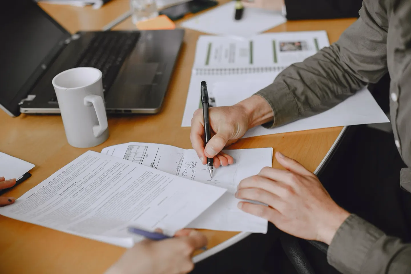 Client signing a design appointment document